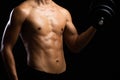 Closeup of a strength fitness body with dumbbell. Fit young man with beautiful torso. Beginner Bodybuilder and muscular body Royalty Free Stock Photo