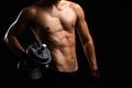 Closeup of a strength fitness body with dumbbell. Fit young man with beautiful torso. Beginner Bodybuilder and muscular body Royalty Free Stock Photo