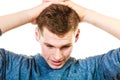 Closeup stressed man holds head with hands Royalty Free Stock Photo