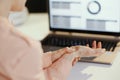 Closeup on stressed modern woman with laptop having wrist pain Royalty Free Stock Photo