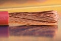 Copper cable on metallic table with blurred background