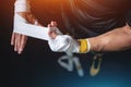 Close up of boxer man bandage hand and preparing for training or fighting in gym