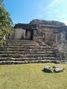 Closeup of structure on steps in Kohunlich Mayan ruins