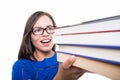 Close-up of student girl holding bunch of books