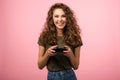 Closeup studio portrait of pretty gamer girl with gamepad