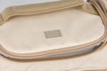 Closeup studio shot of cream beige color multifunction multipurpose utility square shape temperature control zipper newborn baby