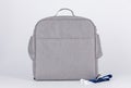 Closeup studio shot of gray color multifunction multipurpose utility zipper newborn baby toddler mommy handbag with milk bottle