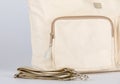 Closeup studio shot showing inside compartments of cream beige color multifunction multipurpose utility newborn baby toddler mommy