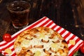 Closeup studio shot hot oven baked tasty delicious Italian homemade ham pineapple traditional Hawaiian bread crust round pizza Royalty Free Stock Photo