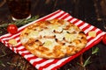 Closeup studio shot hot oven baked tasty delicious Italian homemade ham pineapple traditional Hawaiian bread crust round pizza Royalty Free Stock Photo