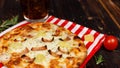 Closeup studio shot hot oven baked tasty delicious Italian homemade ham pineapple traditional Hawaiian bread crust round pizza Royalty Free Stock Photo