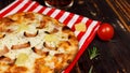 Closeup studio shot hot oven baked tasty delicious Italian homemade ham pineapple traditional Hawaiian bread crust round pizza Royalty Free Stock Photo