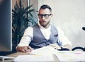 Closeup Stylish Bearded Businessman Wearing Glasses White Shirt Waistcoat Working Modern Loft Startup.Creative Young Guy Royalty Free Stock Photo