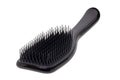 Closeup of a stylish new black hair brush isolated on white background. Concept of body and beauty care. Clipping path. Macro Royalty Free Stock Photo