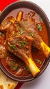 Closeup succulent Lamb Rogan Josh served with Naan.