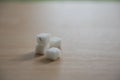 Closeup sugar and ant on wooden table Royalty Free Stock Photo