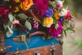 closeup of a suitcase with colorful floral arrangement Royalty Free Stock Photo