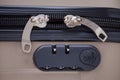 Closeup of suitcase with combination lock and zero numbers