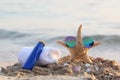 Closeup of Summer beach with sunglasses on starfish and sun protection cream, towel in tropical beach Royalty Free Stock Photo