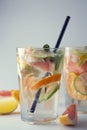 Closeup summer drink. Homemade lemonade, juice or cocktail with sparkling water, citrus fruits. Refreshing cold drink Royalty Free Stock Photo