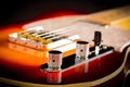 Closeup of sunburst electric guitar on dark background