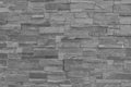 Closeup surface brick pattern at old black stone brick wall textured background in black and white tone Royalty Free Stock Photo