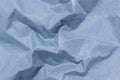 Closeup surface of crumpled dark blue paper texture background