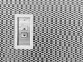 Closeup surface elevator button in up and down arrow sign on steel wall textured background in black and white tone with copy spac Royalty Free Stock Photo