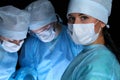 Closeup of surgeons performing operation. Focus on female nurse. Medicine, surgery and emergency help concepts Royalty Free Stock Photo