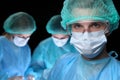 Closeup of surgeons performing operation. Focus on male doctor. Medicine, surgery and emergency help concepts Royalty Free Stock Photo