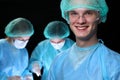 Closeup of surgeons performing operation. Focus on male doctor. Medicine, surgery and emergency help concepts Royalty Free Stock Photo