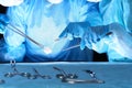 Closeup of surgeons performing operation. Focus on professional tools. Medicine, surgery and emergency help concepts