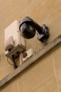Closeup surveillance video camera facade security monitoring Royalty Free Stock Photo