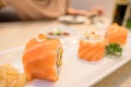 Closeup Sushi roll with fresh salmon In white plate . Japanese style Food Royalty Free Stock Photo