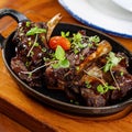 Closeup of sweet baby pork back ribs with greens