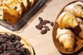 Closeup of sweets and pastries and fresh bakery - biscuit cookies, biscotti, pieces of dark chocolate, raisins, croissants Royalty Free Stock Photo