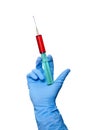 Closeup of syringe filled with blood in doctors hand isolated on white