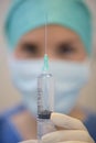 Closeup syringe held by nurse