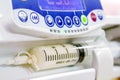 Closeup syringe pump machine pumping milk