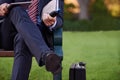 Closeup, tablet and business man on bench, park and planning with lunch break and professional. Employee, outdoor and Royalty Free Stock Photo