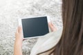 Closeup tablet computer on asian woman hand on blurred gray carp Royalty Free Stock Photo