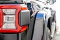 Closeup of a taillight on a modern black car with reflection. Shallow depth of field. Selective focus Royalty Free Stock Photo