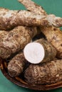 closeup of taro root vegetable, eddo malanga, green background Royalty Free Stock Photo