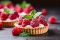 closeup of tartlets with fresh berries, bakery dessert with sweet raspberry on wooden background