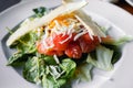 Closeup tasty grill vegetarian Slices of smoked salmon with bread, letuce arugula and cheese in european style, meal on large roun