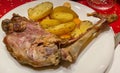 Closeup of tasty leg of lamb meat cooked on BBQ served at elegant restaurant Royalty Free Stock Photo