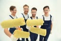Closeup.a team of builders with paint rollers.i Royalty Free Stock Photo