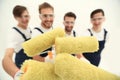 Closeup.a team of builders with paint rollers.i Royalty Free Stock Photo