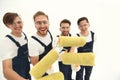 Closeup.a team of builders with paint rollers.i Royalty Free Stock Photo
