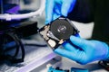 Closeup of technician repairing hard disk for data recovery in tech lab, symbolizing innovation, IT maintenance, and digital Royalty Free Stock Photo